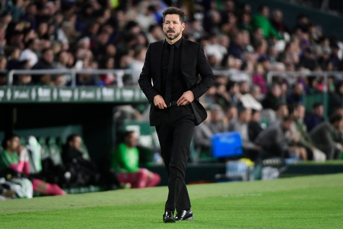 Atletico Madrid's Argentine coach Diego Simeone walks along the touchline during the Spanish league football match between Real Betis and Club Atletico de Madrid at the Benito Villamarin stadium in Seville on October 27, 2024. Photo by CRISTINA QUICLER / AFP.