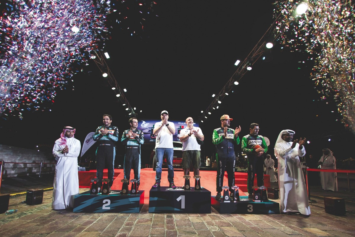 QMMF President Abdulrahman Al Mannai (right) and QMMF Executive Director Amro Al Hamad applaud the podium winners of cars category at the presentation ceremony yesterday.  