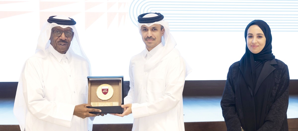 QOC Secretary General Jassim bin Rashid Al Buenain presents a memento to Asian Athletics Association President Dahlan Al Hamad.