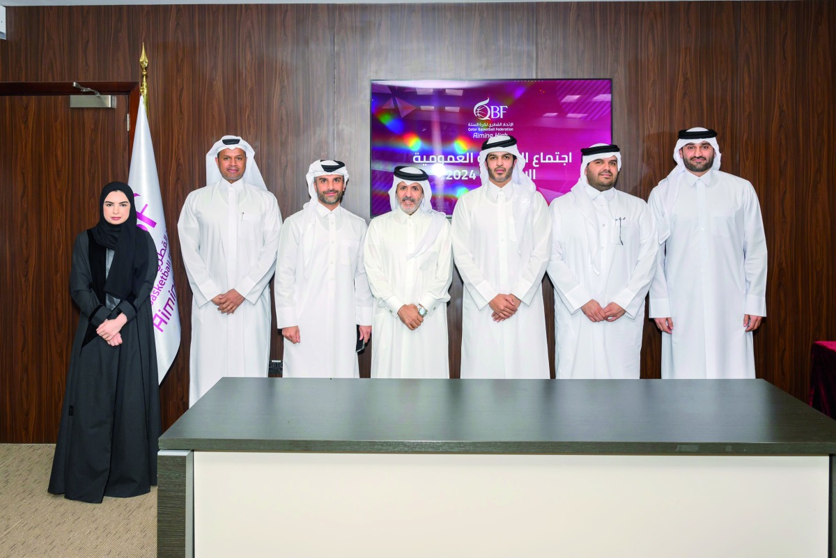 Qatar Basketball Federation President Mohammed bin Saad Al Mughaiseeb  (third right) poses for a photo with other officials during the General Assembly meeting held yesterday.