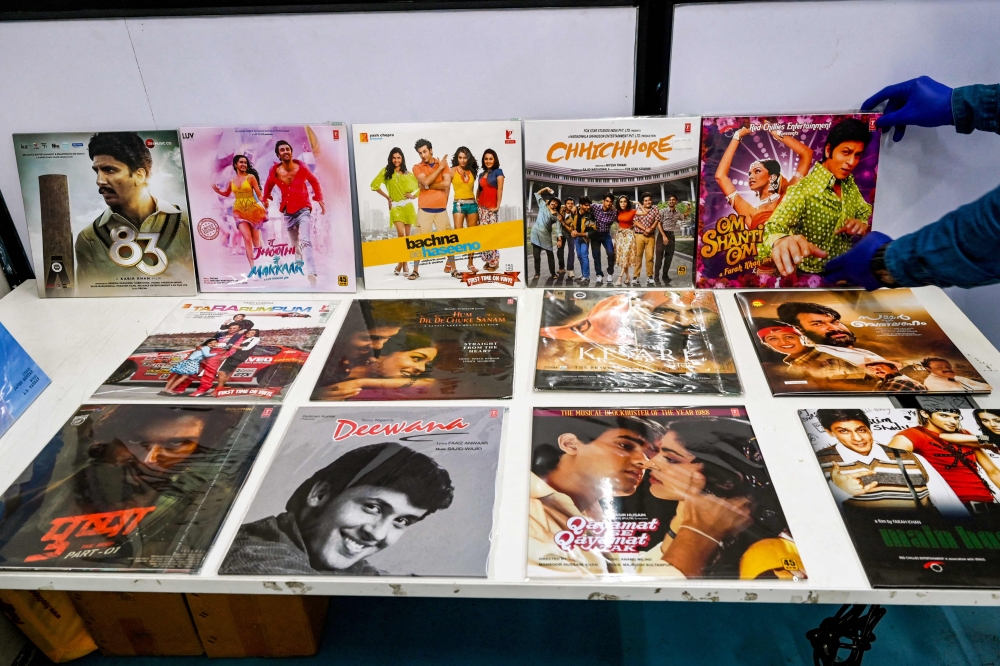 In this photograph taken on September 21, 2024, an employee arranges Vinyl records at a pressing plant in Navi Mumbai. (Photo by Indranil Mukherjee / AFP)