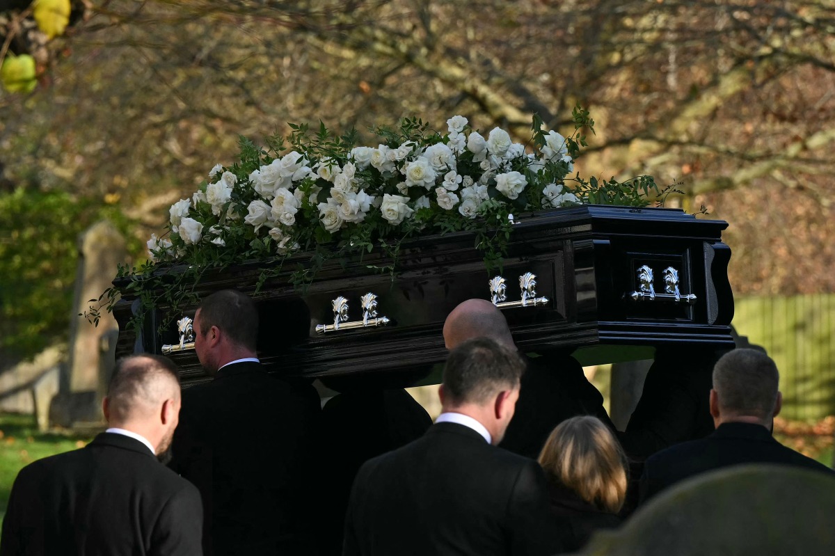 Pallbearers carry the coffin of the late One Direction singer Liam Payne, into the church ahead of his funeral service in the Home Counties, to the west of London, on November 20, 2024. Photo by JUSTIN TALLIS / AFP