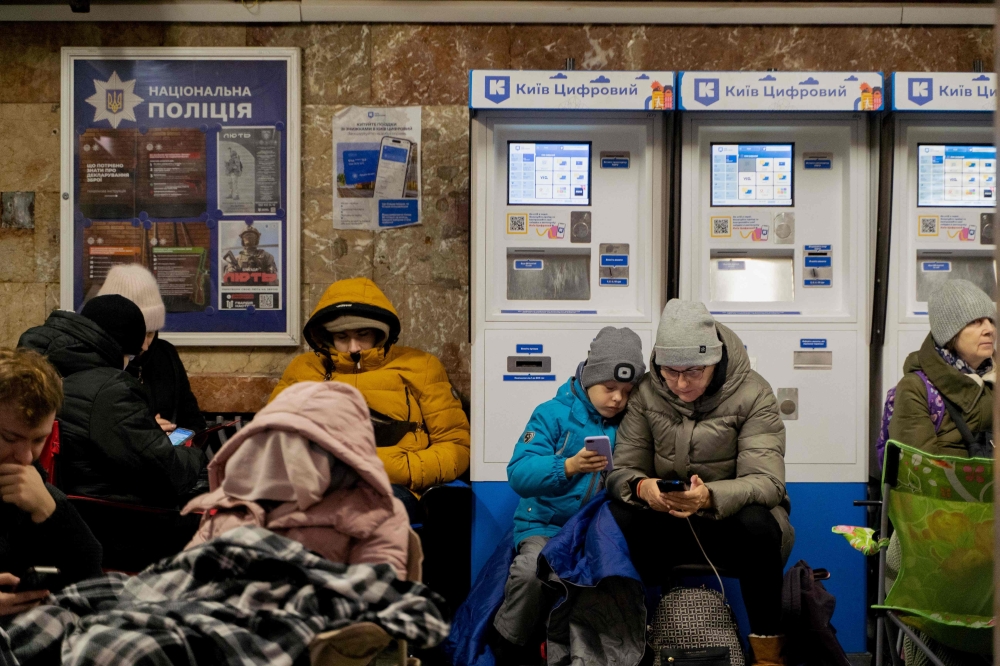 Local residents take shelter in a metro station during an air strike alarm in Kyiv, on November 28, 2024, amid the Russian invasion of Ukraine. (Photo by Tetiana Dzhafarova / AFP)
