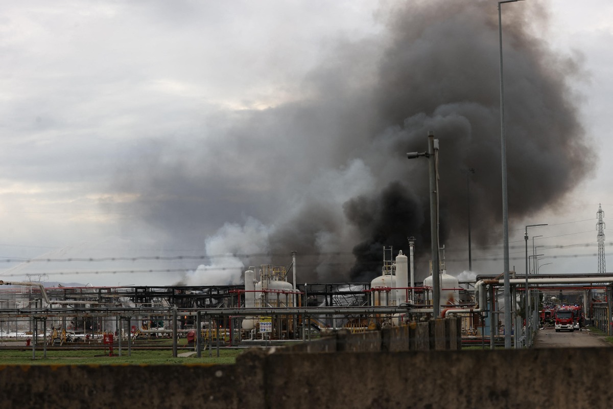 Smoke billows after a fire broke out at a fuel depot run by Italian energy company Eni in Calenzano, near Florence, on December 9, 2024. (Photo by Claudio GIOVANNINI / ANSA / AFP)