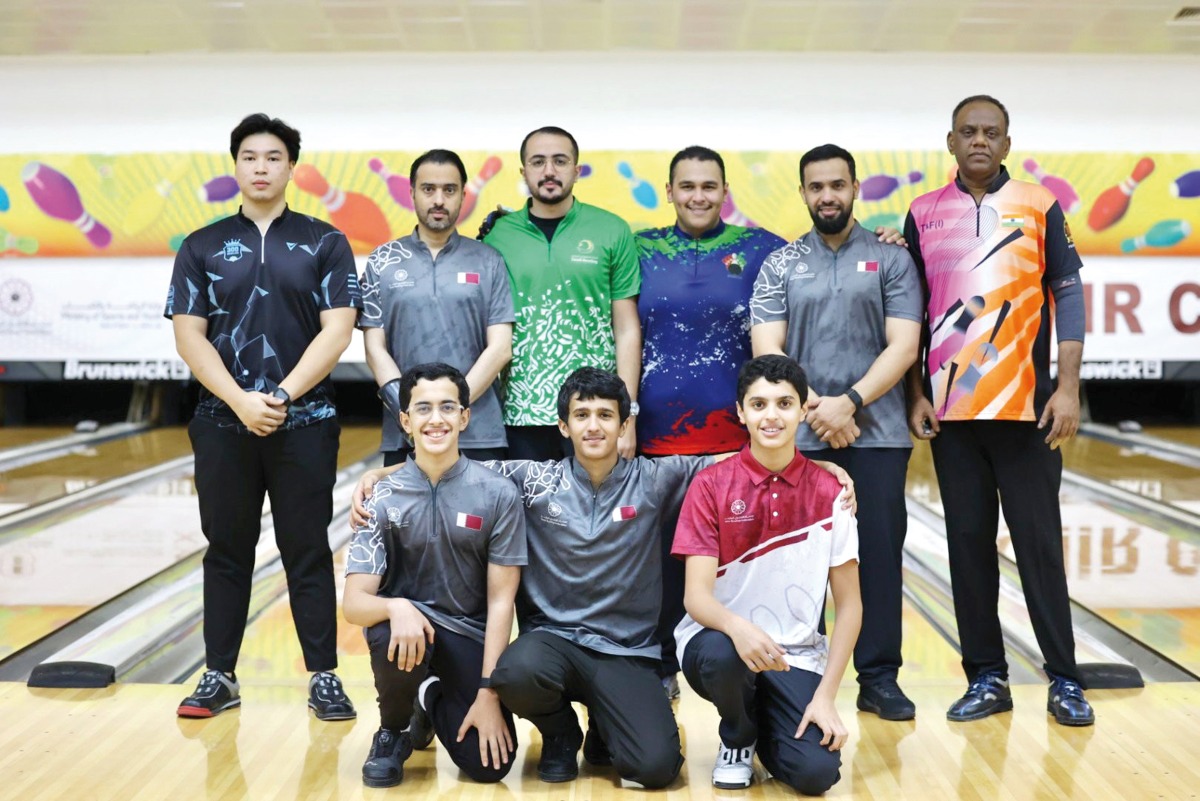 Qatar’s Talal Al Marri (front right) poses for a photo along with other participants.   