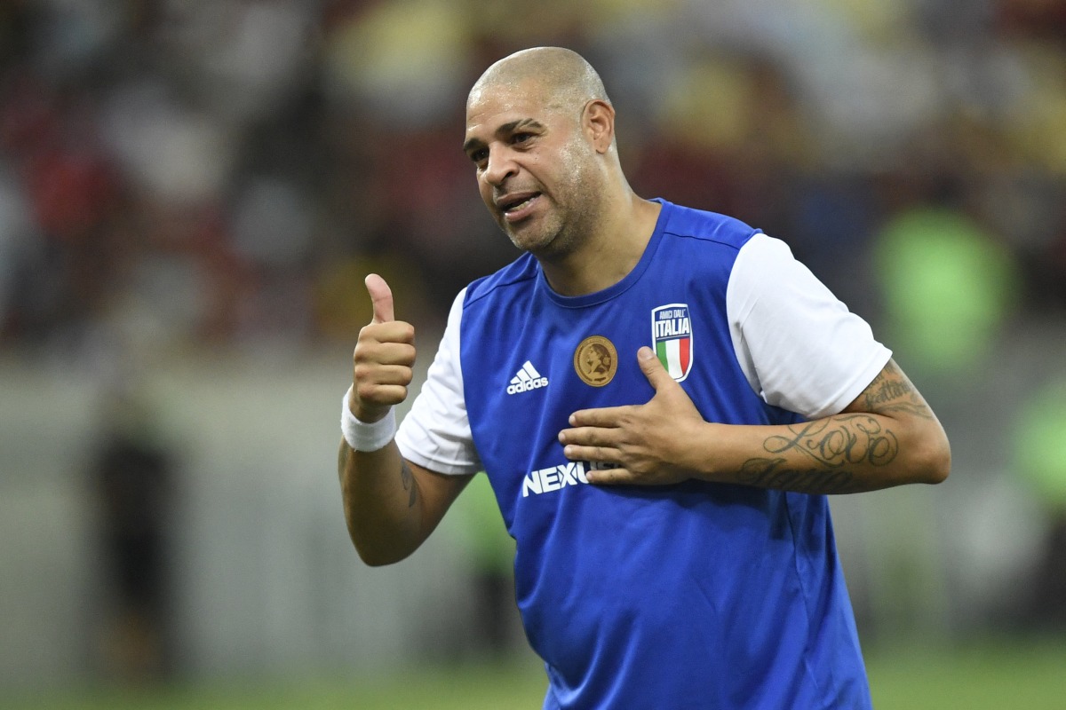 Brazilian former football player Adriano gestures during his friendly farewell match with legends of Brazil's Flamengo and Italy's Inter Milan at Maracana Stadium in Rio de Janeiro on December 15, 2024. (Photo by Daniel RAMALHO / AFP)