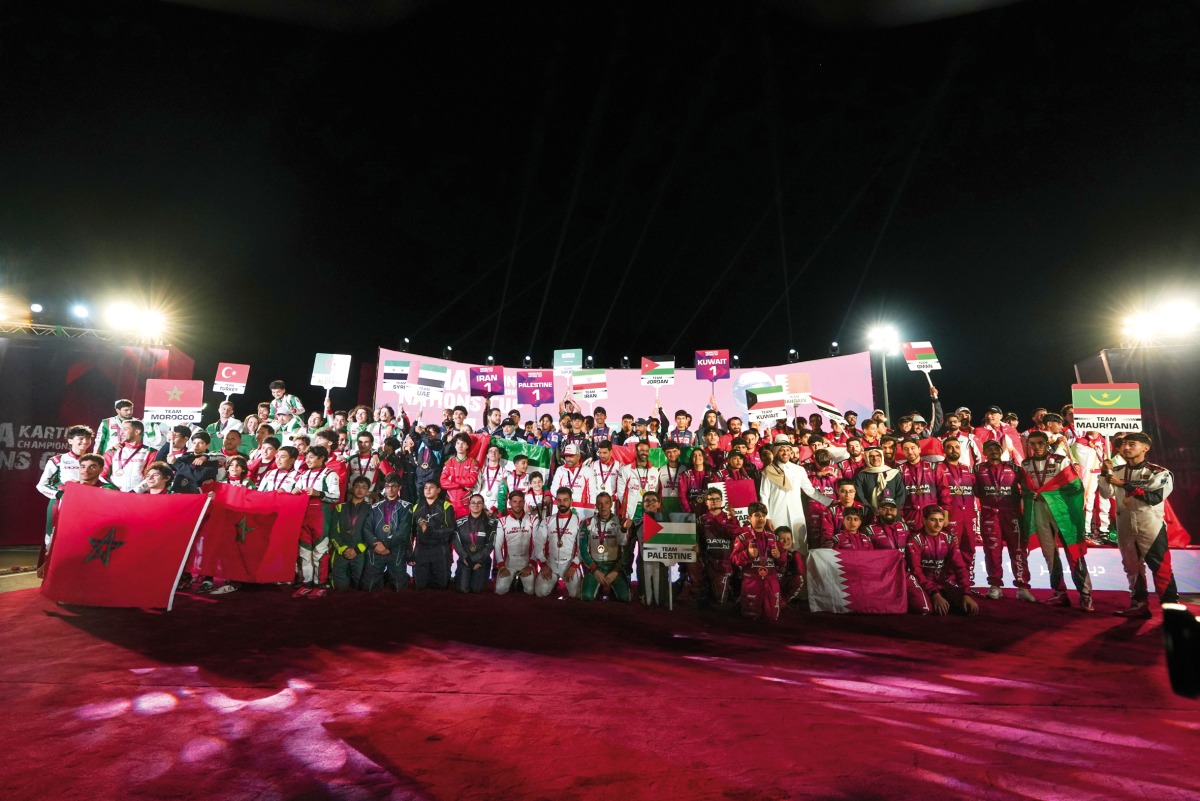 QMMF Executive Director and CEO of Lusail International Circuit Amro Al Hamad poses for a photo with the contingents of participating nations during the opening ceremony of MENA Karting Championship Nations Cup 2024 yesterday. 