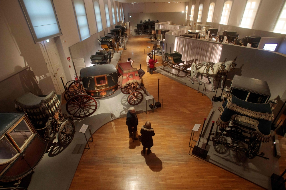 Carriages are pictured in an exhibition hall at the Imperial Carriage Castle Museum (Wagenburg) of the Schoenbrunn Palace in Vienna on December 5, 2024. (Photo by Alex Halada / AFP)
