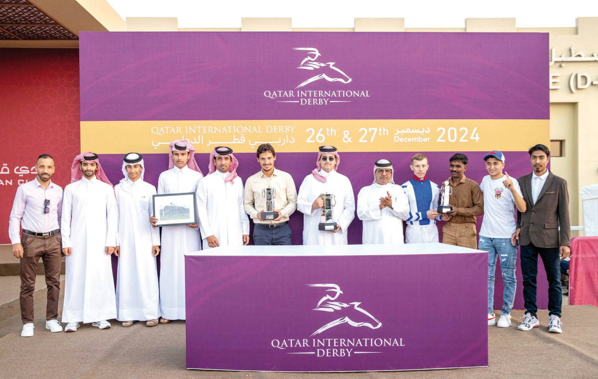 The connections of Warming celebrate after landing the Qatar Oaks at Al Uqda Racecourse yesterday. 