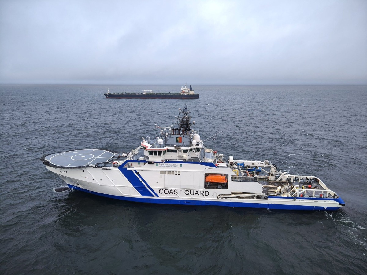 This handout picture released by The Finnish Border Guard on December 26, 2024 shows a Finnish Border Guard's ship Turva (front) and the oil tanker Eagle S on the sea near Porkkalanniemi. Photo by Handout / Finnish Border Guard / AFP