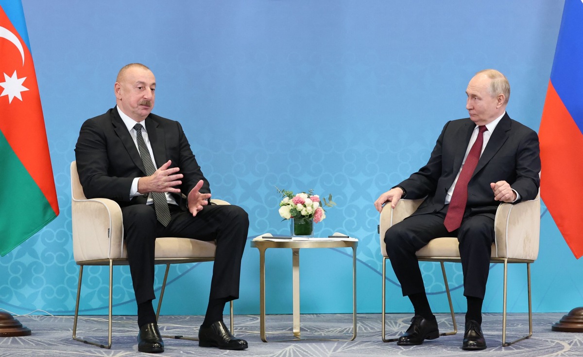 (FILES) In this pool photograph distributed by the Russian state agency Sputnik, Russia's President Vladimir Putin meets with Azerbaijani President Ilham Aliyev on the sidelines of the Shanghai Cooperation Organisation (SCO) member states leaders' summit in Astana on July 3, 2024. (Photo by Sergei SAVOSTYANOV / POOL / AFP)
