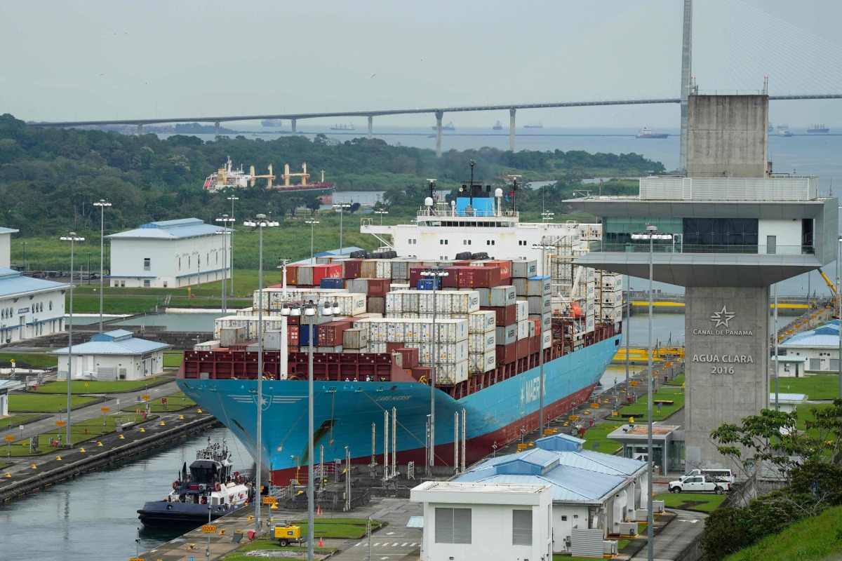 A cargo ship sails through the Agua Clara Locks of the Panama Canal in Colon City, Panama, on December 28, 2024. (Photo by ARNULFO FRANCO / AFP)
