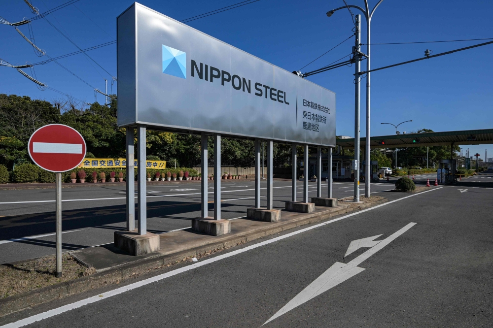 File: An entrance sign for Japanese company Nippon Steel's East Nippon Works Kashima Area facility is pictured in Kashima, Ibaraki prefecture, north of Tokyo on December 6, 2024.  (Photo by Richard A Brooks / AFP)