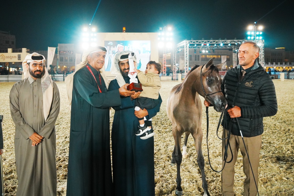 General Supervisor of Souq Waqif Equestrian Festival 2025 Abdulrahman Al Naama (second left) with a winner of a competition at 6th Souq Waqif International Arabian Horse Show (A).