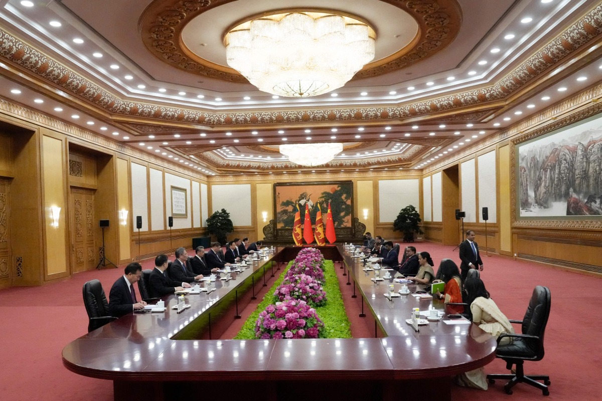 Sri Lankan President Anura Kumara Dissanayake (5th R) speaks during a meeting with Chinese President Xi Jinping at the Great Hall of the People in Beijing on January 15, 2025. (Photo by Aaron Favila / POOL / AFP)