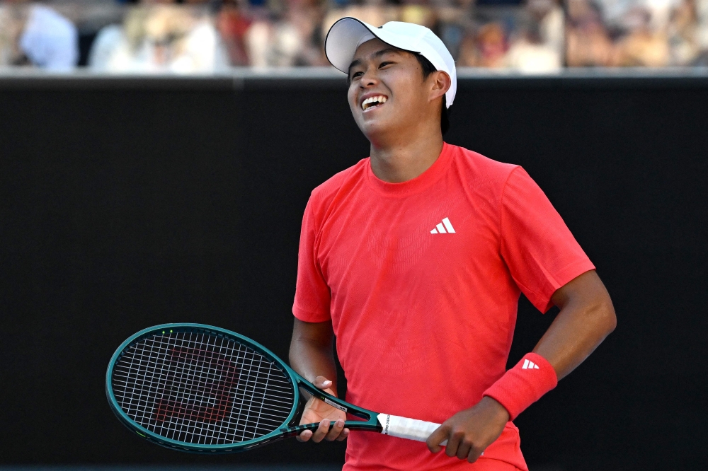USA's Learner Tien celebrates victory against France's Corentin Moutet during their men's singles match on day seven of the Australian Open tennis tournament in Melbourne on January 18, 2025. (Photo by Paul Crock / AFP)