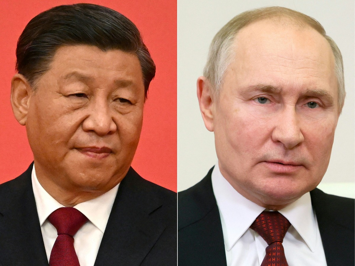 (FILES) (COMBO) This combination of pictures created on December 30, 2022 shows China's President Xi Jinping (L); and Russian President Vladimir Putin (R) (Photo by Noel CELIS and Mikhail Metzel / various sources / AFP)
