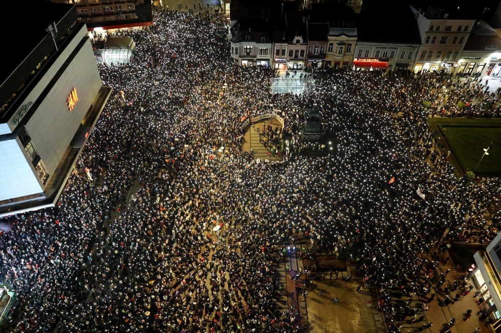 An aerial photograph shows demonstrators gathering during a protest over the fatal roof collapse of the Novi Sad train station on January 26, 2025. (Photo by Sasa Djordjevic / AFP)
 