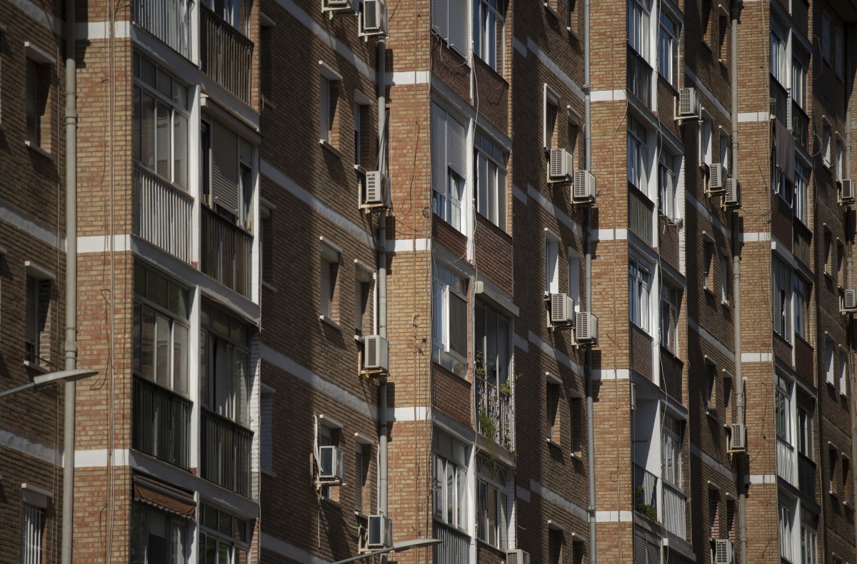 In this representational file photo, air conditioners are seen on the facade of a residential building in Malaga, southern Spain, on July 28, 2023. (Photo by JORGE GUERRERO / AFP)