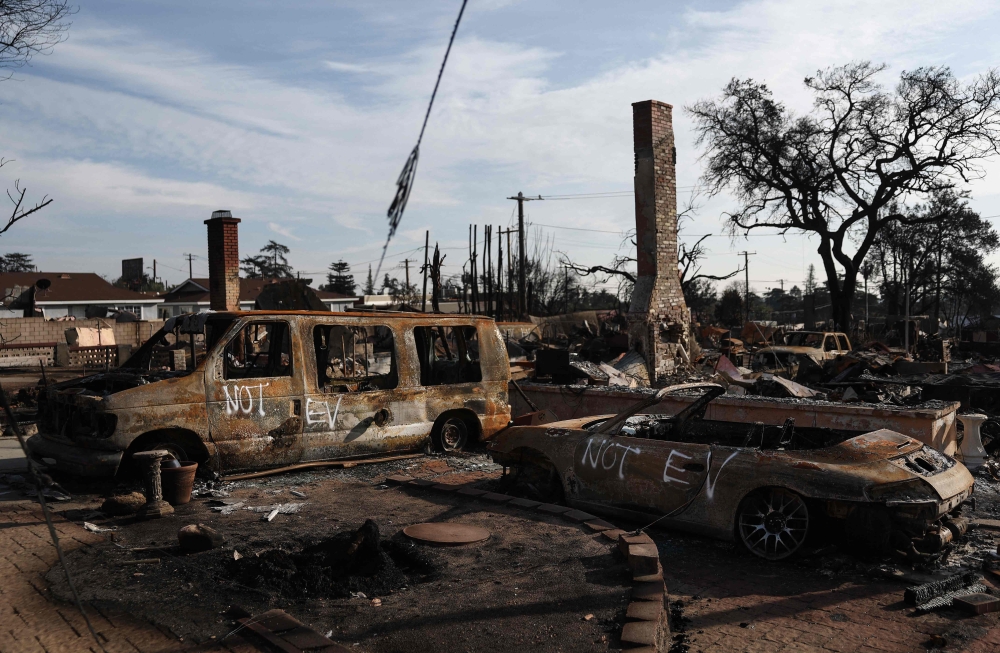 Vehicles which burned in the Eaton Fire are marked 'NOT EV' as EPA hazardous materials disposal ramp up on January 31, 2025 in Altadena, California. Mario Tama/Getty Images/AFP