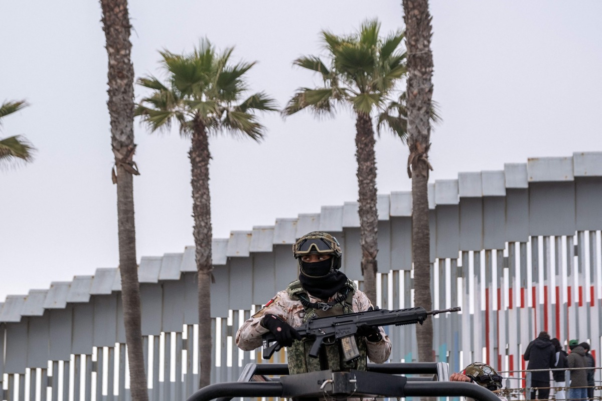A Mexico's Army officer patrols the Mexican side of the US-Mexico border in Playas de Tijuana, Baja California state, Mexico, on February 3, 2025. (Photo by Guillermo Arias / AFP)
