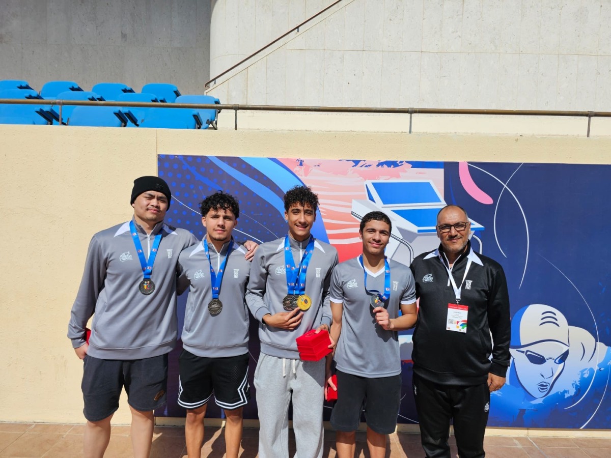 The UDST students with their medals.
