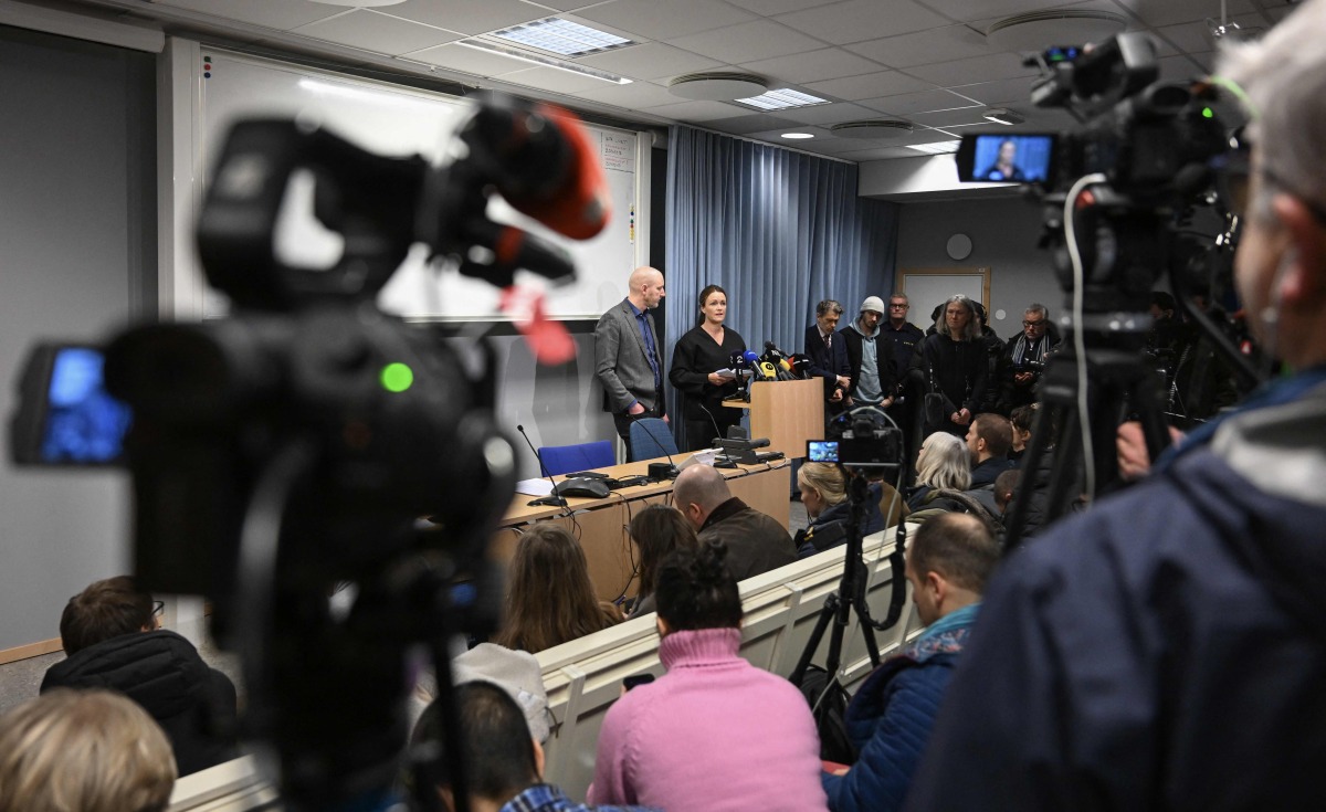 Police chief investigators Kristoffer Zickbauer (L) and Anna Bergkvist (2ndL) attend a press conference in Orebro, Sweden, on February 6, 2025 two days after a shooting at the adult education center Campus Risbergska school, where eleven people including the gunman were killed. Photo by Jonathan NACKSTRAND / AFP