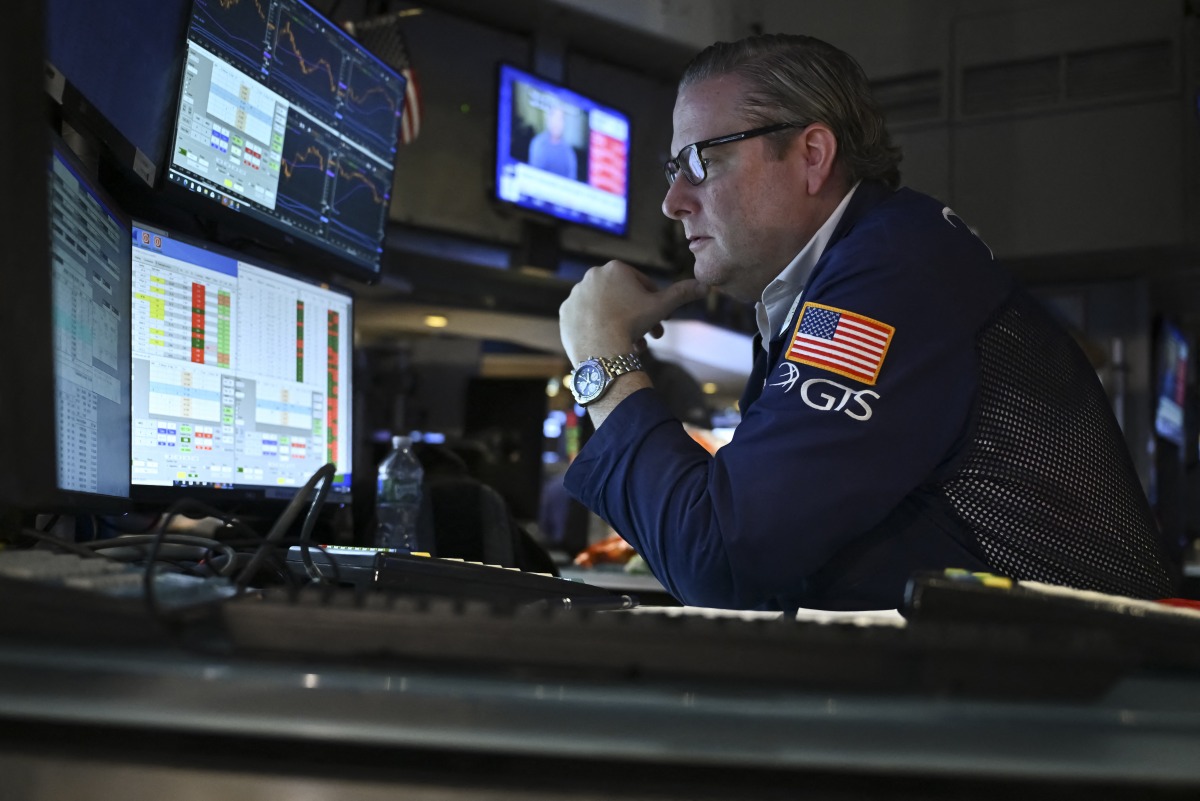Traders work on the floor of the New York Stock Exchange (NYSE) in New York on February 3, 2025. (Photo by ANGELA WEISS / AFP)
