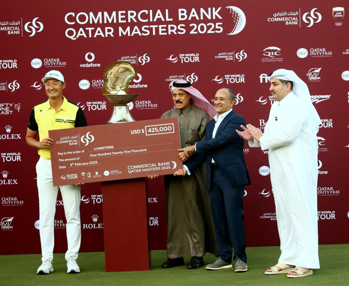 Commercial Bank Board Member Abdul Rahman bin Hamad Al Attiyah and Commercial Bank Group CEO Joseph Abraham along with QGA President Hamad Abdullah Al Mana present the winner’s cheque to China’s Haotong Li at the Doha Golf Club yesterday.