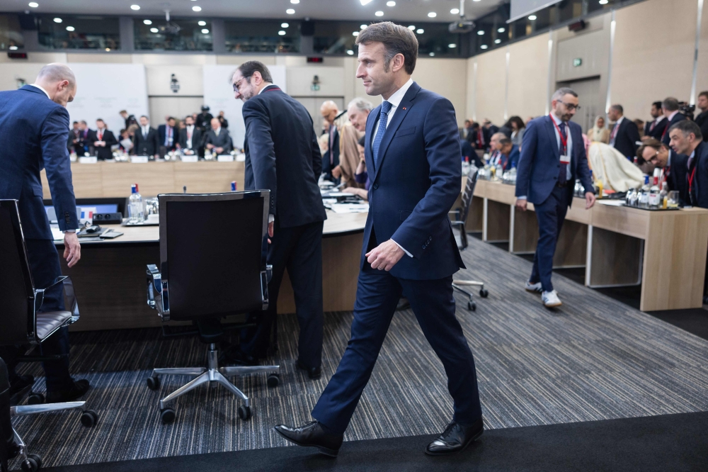 France's President Emmanuel Macron arrives for the International Conference on Syria at the Ministerial Conference Center, in Paris on February 13, 2025. (Photo by Sameer Al-Doumy / AFP)
