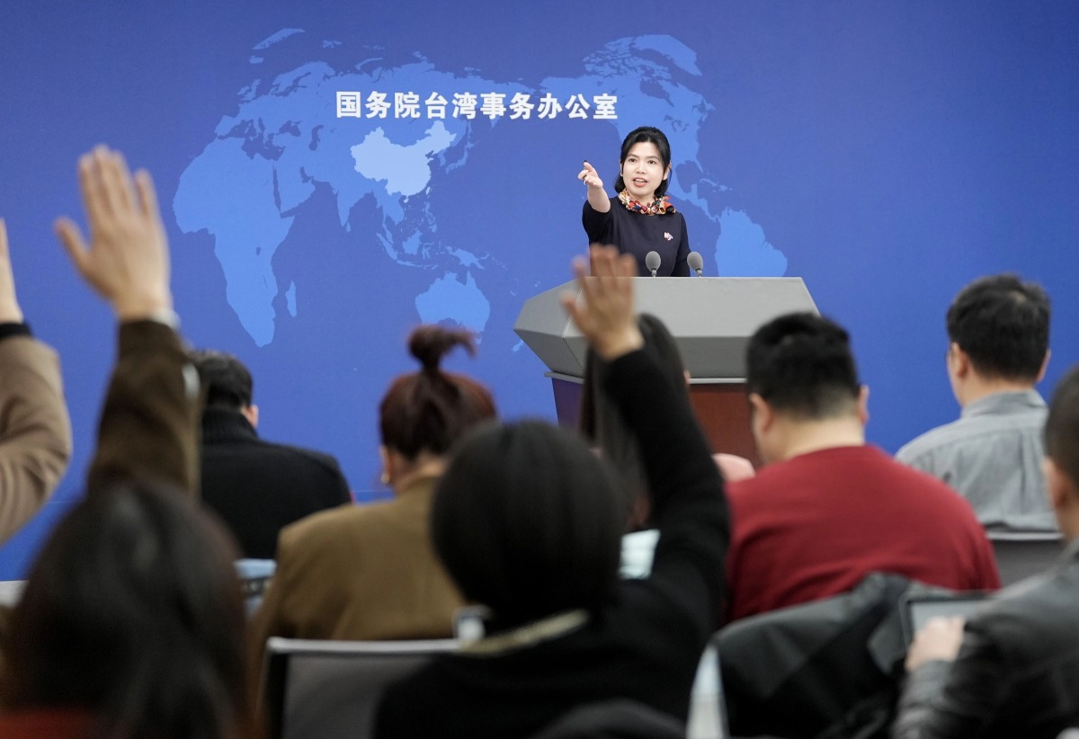 Zhu Fenglian, spokesperson for the State Council Taiwan Affairs Office, gestures at a regular press conference in Beijing, capital of China, Feb. 12, 2025. (Xinhua/Chen Yehua)
