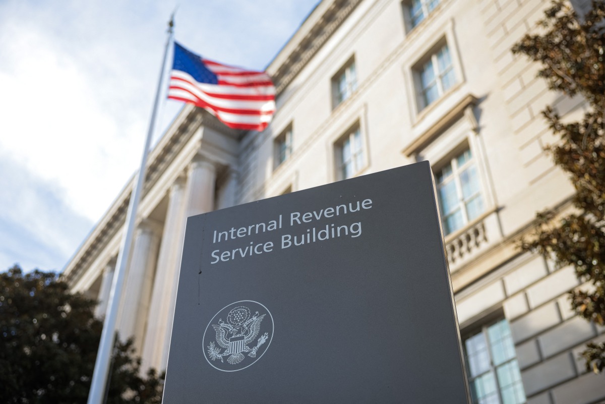 A sign for the Internal Revenue Service (IRS) is seen outside its building on February 13, 2025 in Washington, DC. (Photo by Kayla Bartkowski / GETTY IMAGES NORTH AMERICA / Getty Images via AFP)

