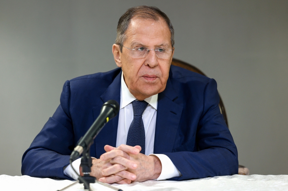 This handout picture taken and released by the Russian Foreign Ministry shows Russia's Foreign Minister Sergey Lavrov giving a press conference after the meeting with US Secretary of State, National Security Advisor and Middle East envoy at Riyadh's Diriyah Palace on February 18, 2025. (Photo by Handout / Russian Foreign Ministry / AFP) 