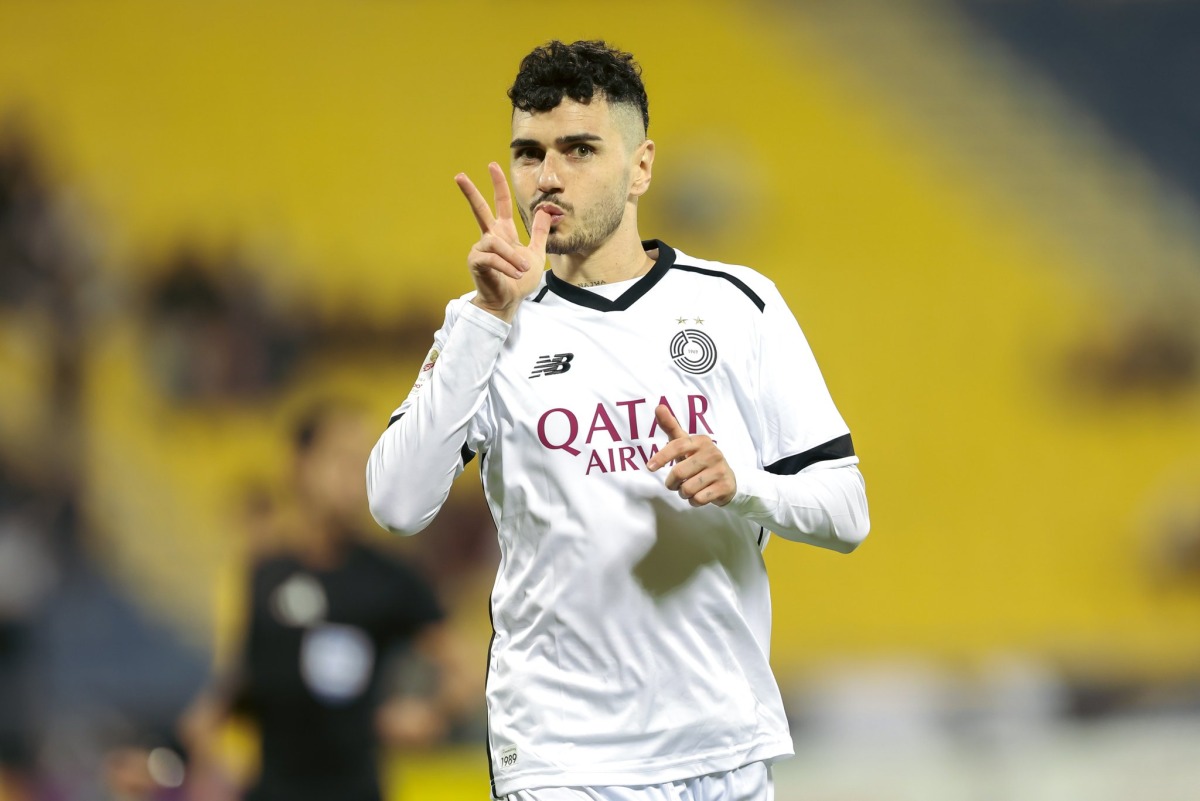 Al Sadd's Rafa Mujica celebrates after scoring a goal.