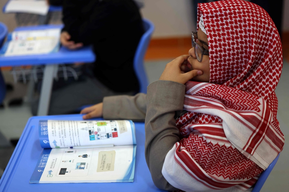 Pupils attend a Mandarin language lesson at a school in Riyadh on February 2, 2025. (Photo by Fayez Nureldine / AFP)