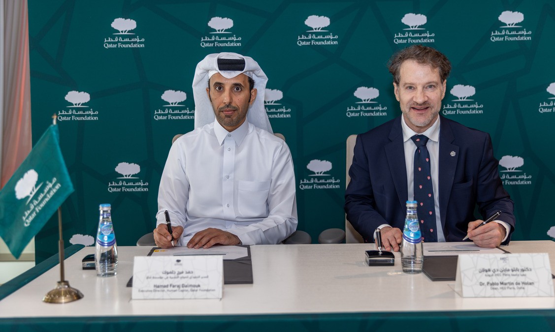 Executive Director, Human Capital, QF, Hamad F Dalmouk (left) and Dean of HEC Paris, Doha, Dr. Pablo Martin de Holan signing the partnership. 