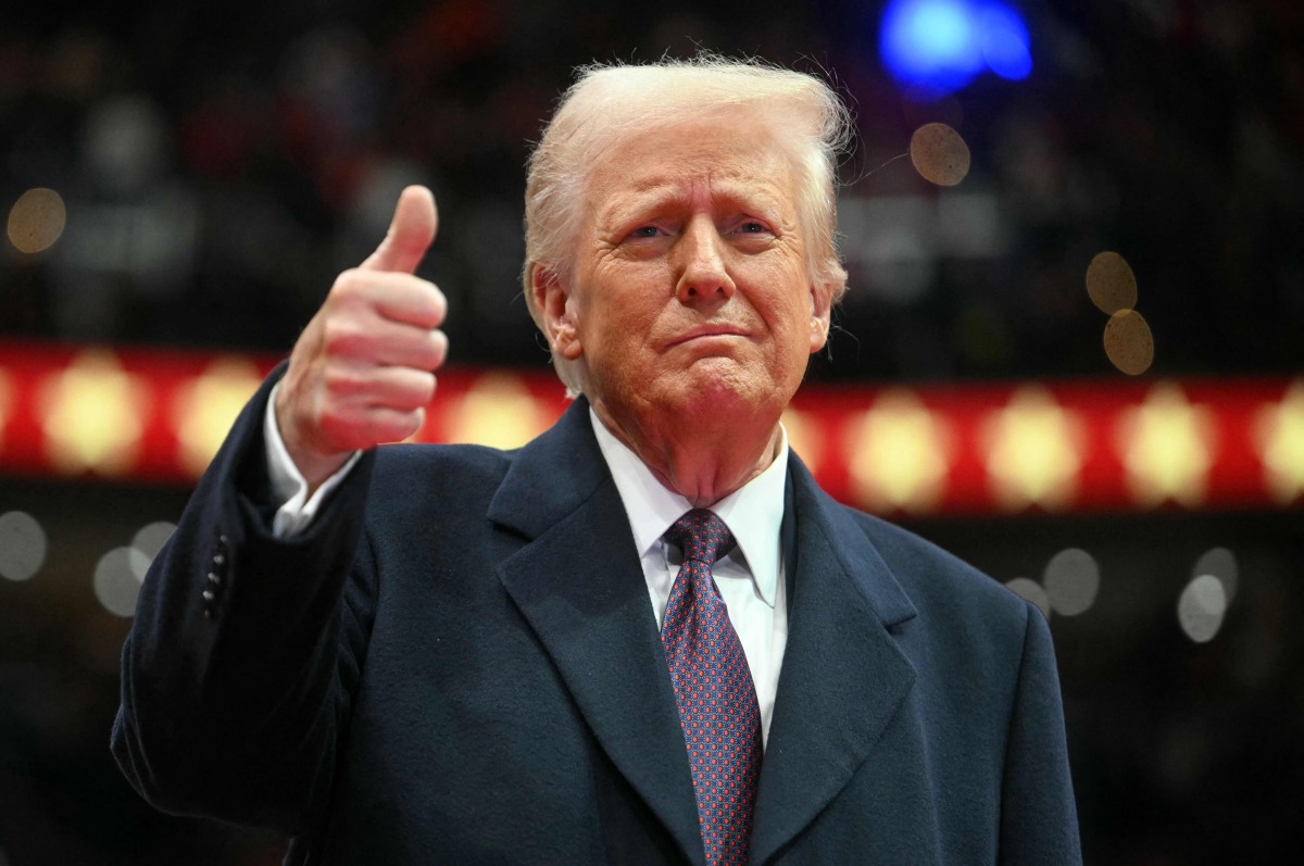 US President Donald Trump gives a thumb's up as he arrives for the inaugural parade inside Capital One Arena, in Washington, DC, on January 20, 2025. Photo by Jim WATSON / AFP