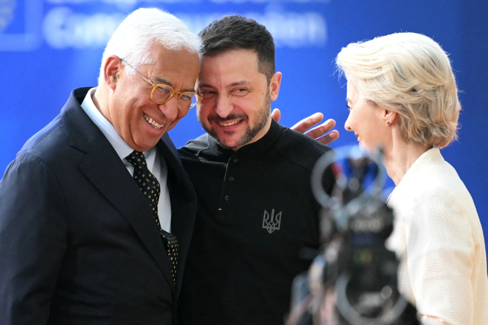 European Council President Antonio Costa (left) and European Commission President Ursula von der Leyen (right) greet Ukraine's President Volodymyr Zelensky as he arrives at the Special European Council to discuss continued support for Ukraine and European defence at the EU headquarters in Brussels on March 6, 2025. (Photo by Nicolas Tucat / AFP)
