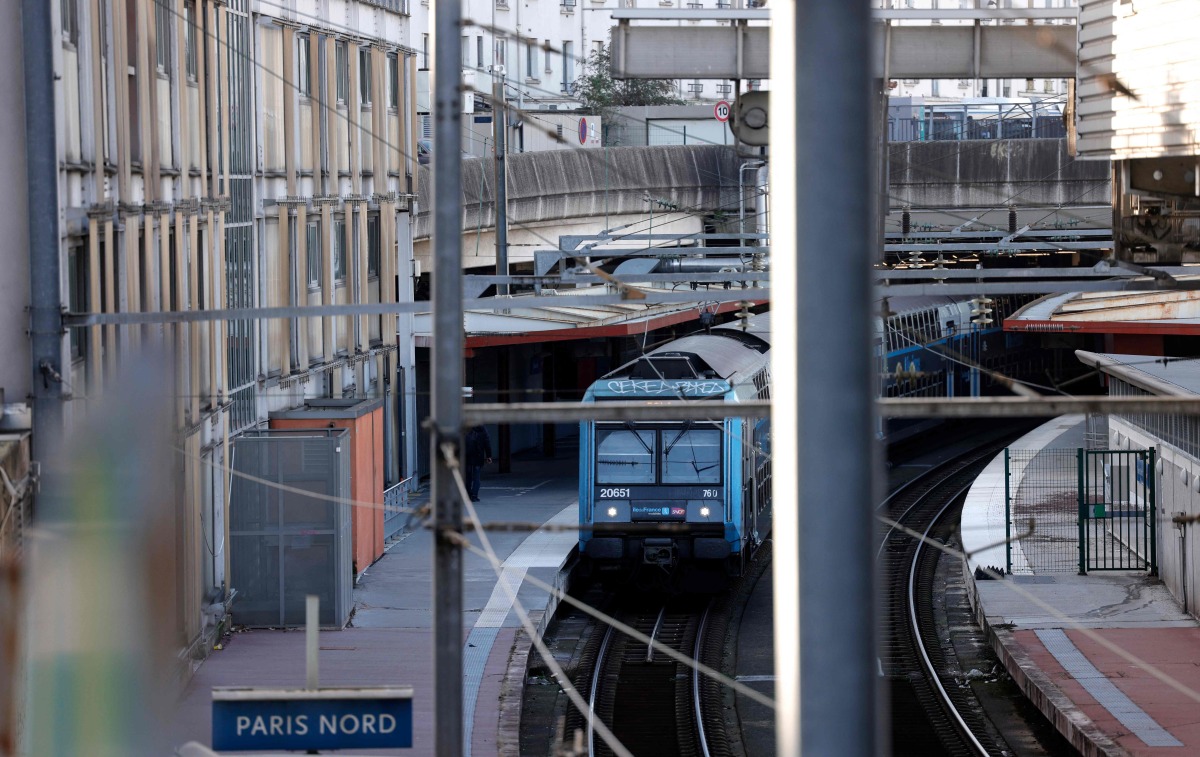 This photograph shows a regional train parked at a platform as traffic has been stopped at the Gare du Nord station in Paris on March 7, 2025, following the discovery of a World War II bomb. Photo by GEOFFROY VAN DER HASSELT / AFP