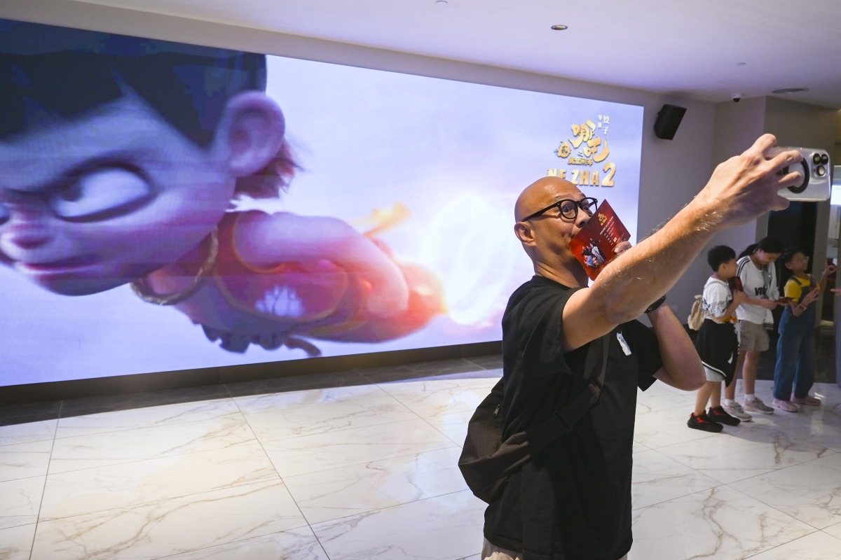 A man poses for a selfie during the premiere of the Chinese animated film 