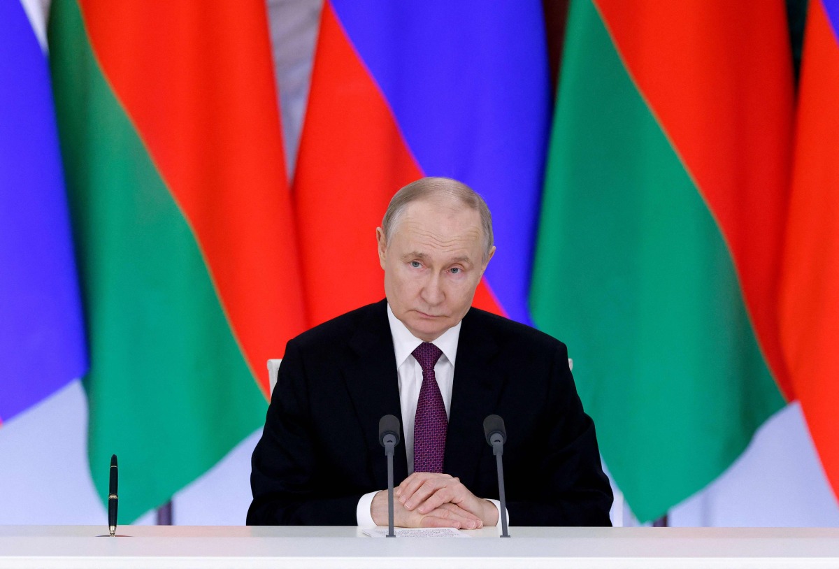 Russia's President Vladimir Putin attends a signing ceremony and a press conference following a meeting with his Belarusian counterpart at the Kremlin in Moscow on March 13, 2025. (Photo by Maxim Shemetov / POOL / AFP)
