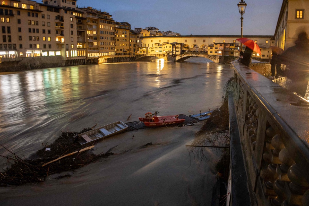 A general view shows the high level of the Arno River near the Ponte Vecchio in Florence, on March 14, 2025. (Photo by Federico SCOPPA / AFP)
