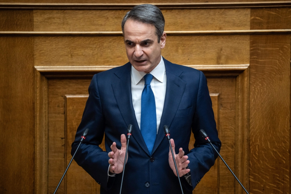 (Files) Greek Prime Minister Kyriakos Mitsotakis addresses the audience at the Greek Parliament in Athens, on March 5, 2025. (Photo by Angelos Tzortzinis / AFP)

