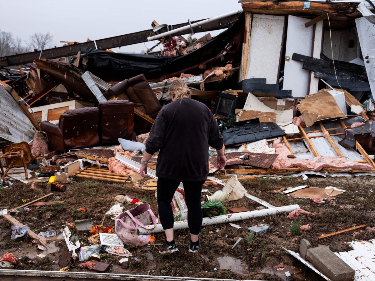 Denise Woodard looks over her destroyed trailer inside of Harmony Hills trailer park on March 15, 2025 in Poplar Bluff, Missouri. (Photo by Brad Vest / GETTY IMAGES NORTH AMERICA / Getty Images via AFP)
