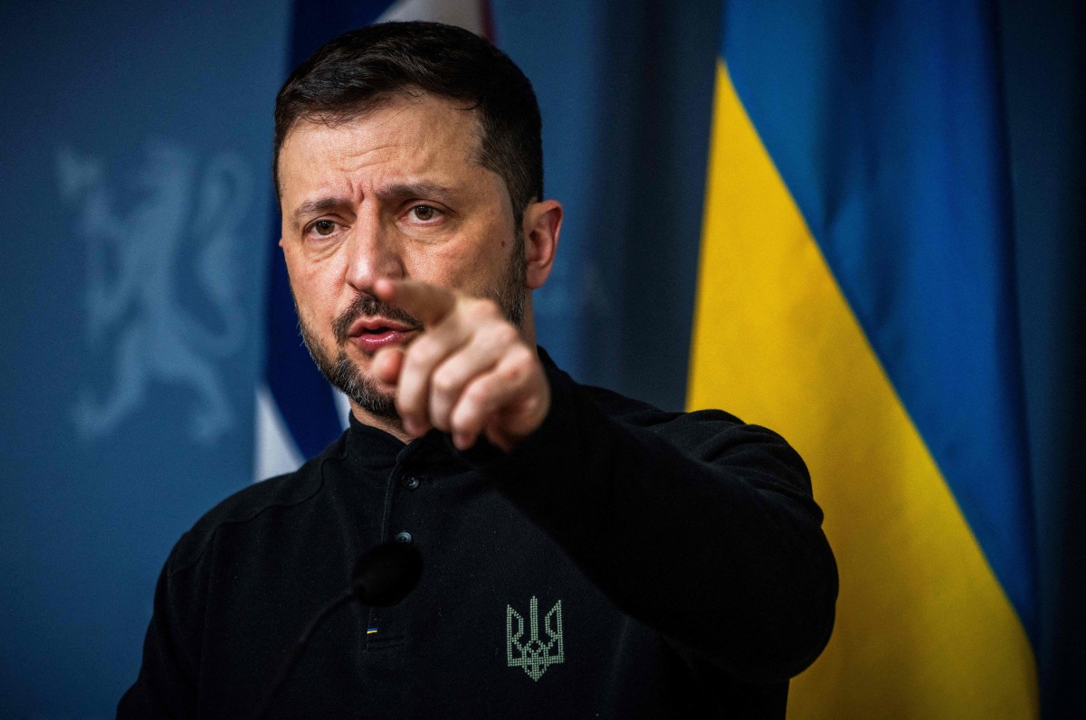 Ukrainian President Volodymyr Zelensky gestures as he addresses a press conference with the Norwegian Prime Minister in the government's representative building in Oslo, Norway on March 20, 2025. (Photo by Ole Berg-Rusten / NTB / AFP) / Norway OUT
