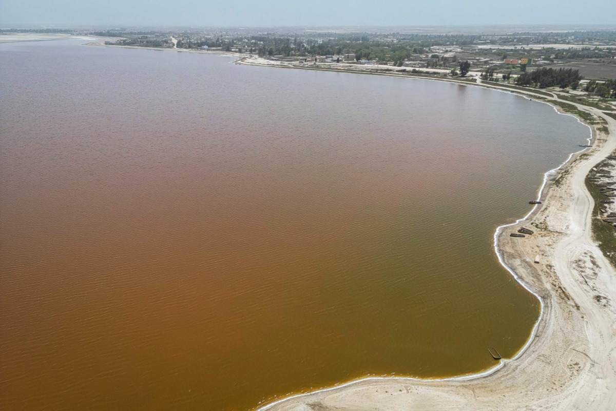 An aerial view of Lake Retba, known as the Pink Lake, in Senegal on March 19, 2025. (Photo by PATRICK MEINHARDT / AFP)

