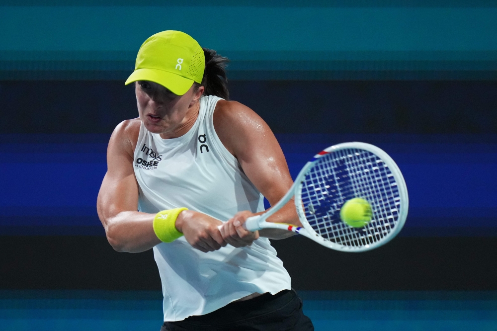 Iga Swiatek of Poland returns a shot against Elina Svitolina of Ukraine during their match on day 7 of the Miami Open at Hard Rock Stadium on March 24, 2025 in Miami Gardens, Florida. (Photo by Rich Storry/Getty Images via AFP)