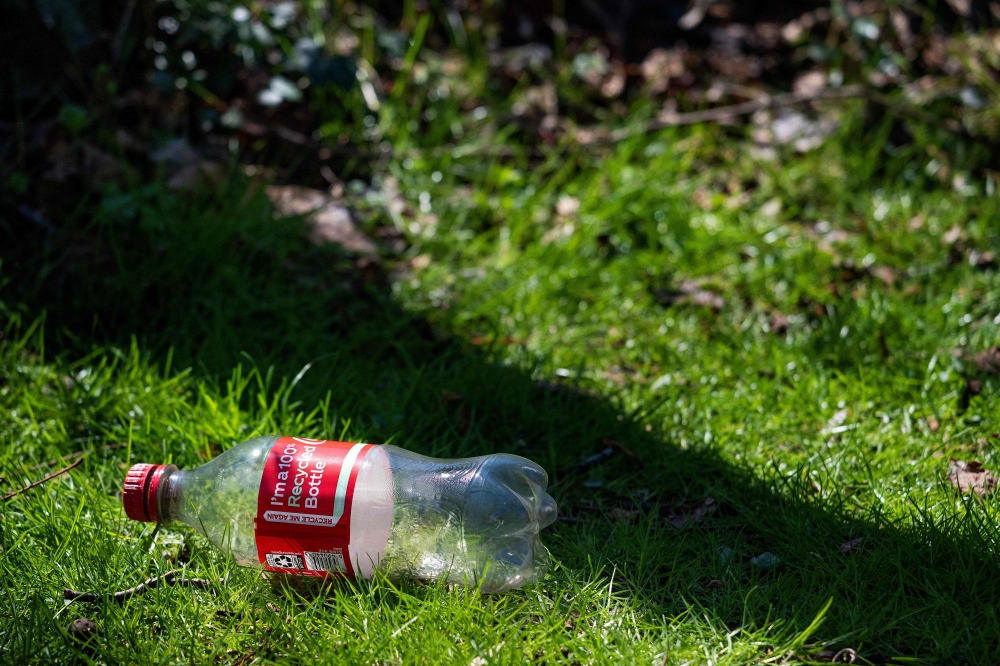 A 100 percent recycled Coca-Cola bottle in Centreville, Maryland on March 25, 2025. (Photo by Jim Watson / AFP)