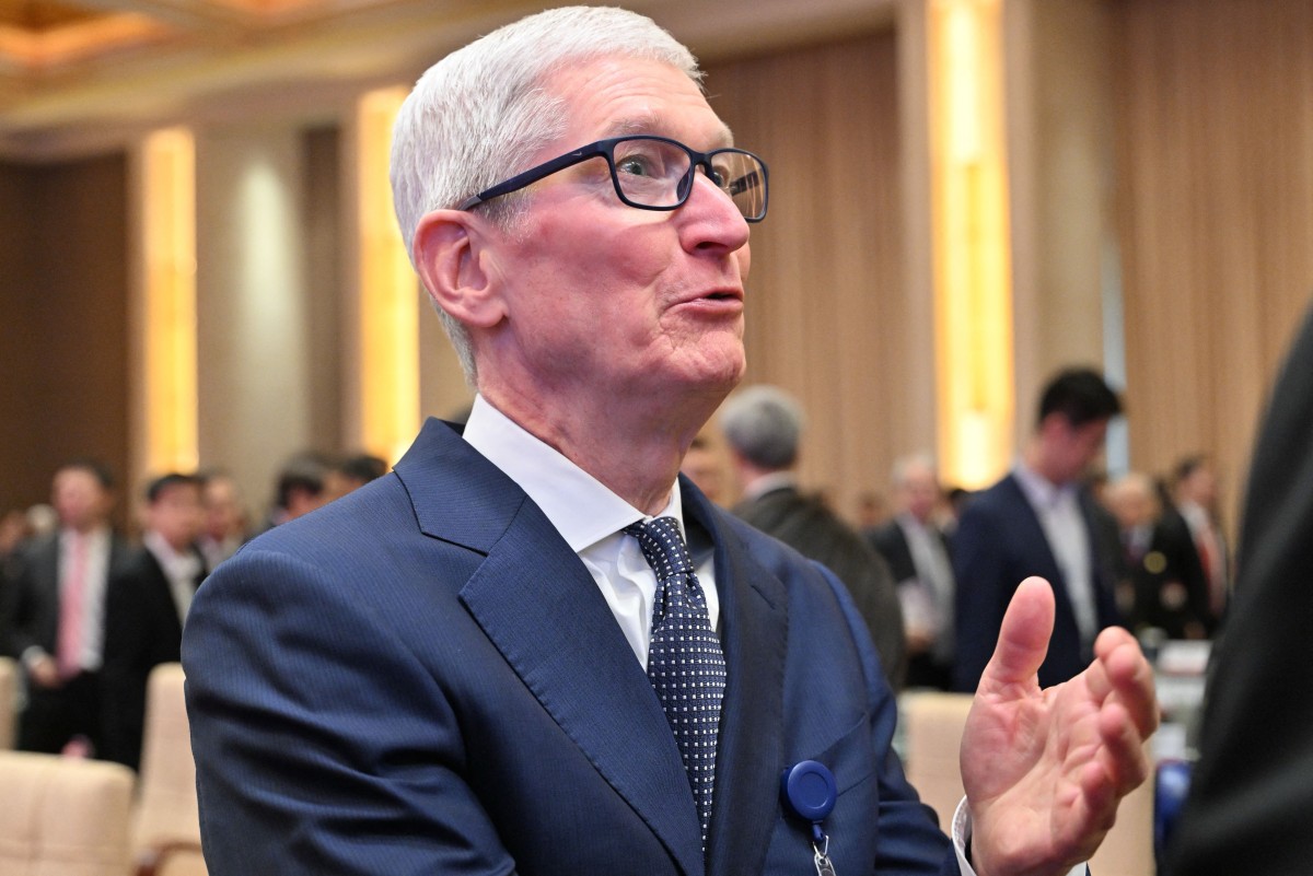 Apple CEO Tim Cook attends the opening ceremony of the China Development Forum at the Diaoyutai State Guesthouse in Beijing on March 23, 2025. (Photo by Adek Berry / Pool / AFP)
