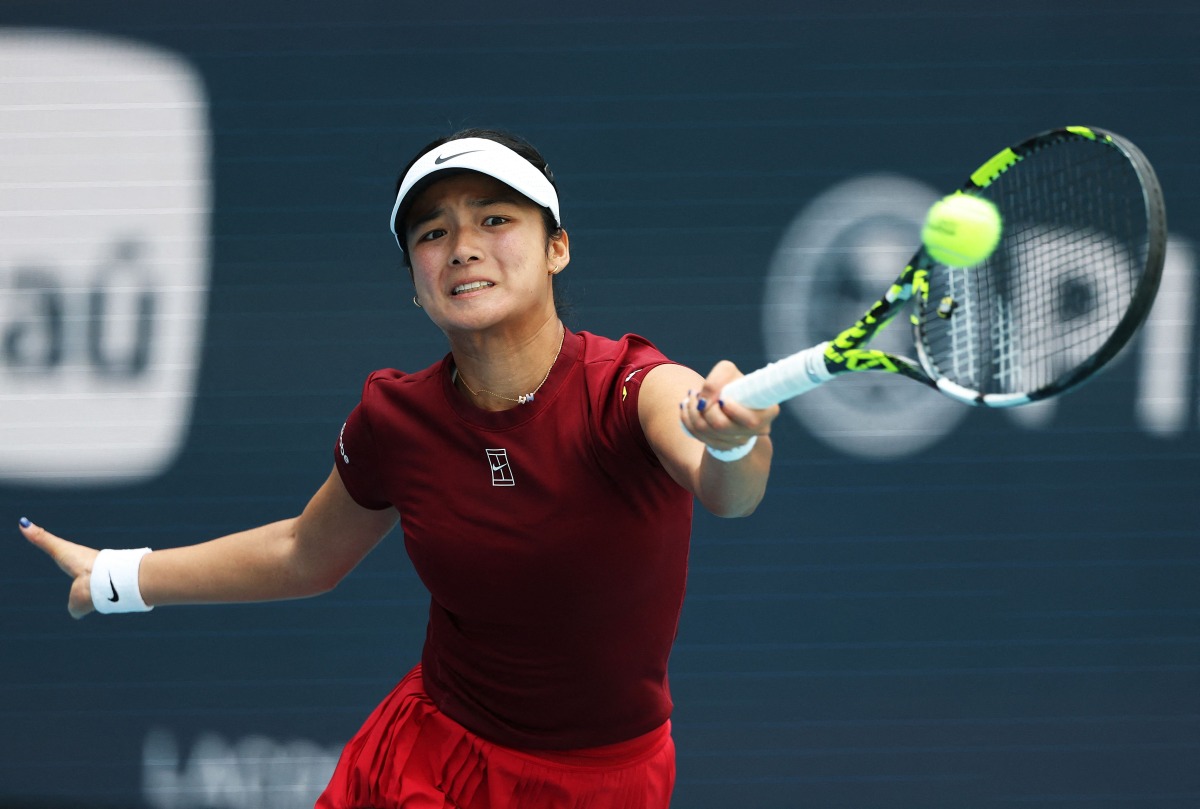 Alexandra Eala of the Philippines returns a shot against Iga Swiatek of Poland during their matchon Day 9 of the Miami Open at Hard Rock Stadium on March 26, 2025 in Miami Gardens, (Photo by AL BELLO / GETTY IMAGES NORTH AMERICA / Getty Images via AFP)

